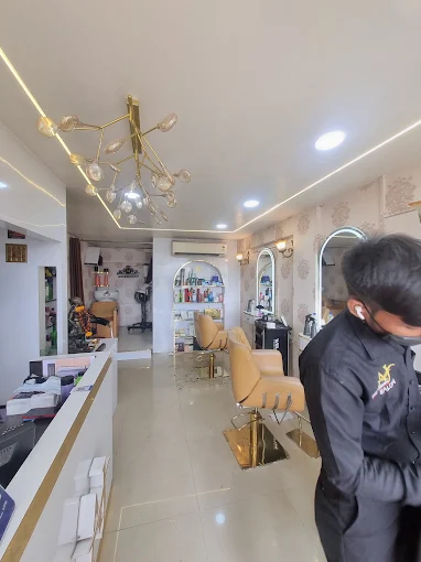 AJ Professional salon interior — styling chairs and chandelier